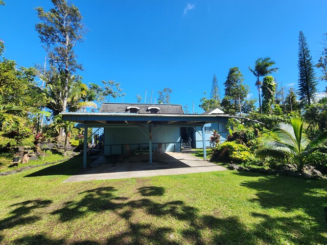 13-1128 Malama St, Pahoa, HI 96778 - rear view of house with a yard and entry steps