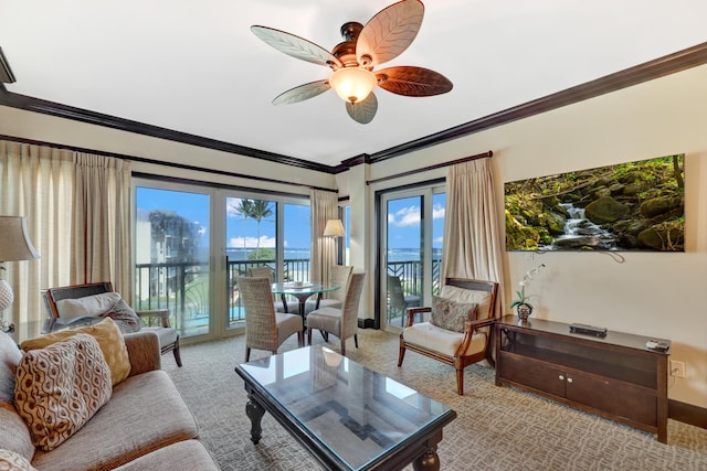 4-820 Kuhio Hwy Unit H304, Kapaa, HI 96746 - living room with crown molding, ceiling fan, baseboards, carpet flooring, and a water view