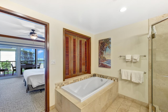 4-820 Kuhio Hwy Unit H304, Kapaa, HI 96746 - ensuite bathroom with a garden tub, a ceiling fan, a tile shower, baseboards, and recessed lighting