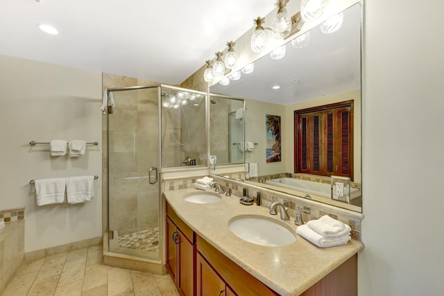 4-820 Kuhio Hwy Unit H304, Kapaa, HI 96746 - full bathroom featuring a stall shower, double vanity, a bath, baseboards, and recessed lighting