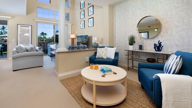 68-1122 Na Ala Hele Rd Unit F3, Kamuela, HI 96743 - carpeted living room featuring wallpapered walls, baseboards, and a high ceiling