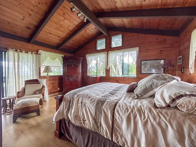 94-2088 S Point Rd, Naalehu, HI 96772 - bedroom with wood walls, wood finished floors, wooden ceiling, and rail lighting