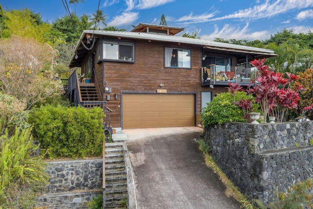 87-3188 Boki Rd, Captain Cook, HI 96704 - view of front of home featuring stairs, a garage, driveway, and a balcony