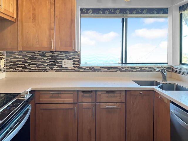 87-3188 Boki Rd, Captain Cook, HI 96704 - kitchen with a sink, stainless steel dishwasher, range with electric stovetop, light countertops, and decorative backsplash