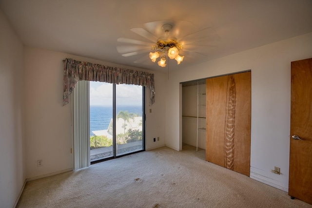 36-2335 Old Mamalahoa Hwy, Laupahoehoe, HI 96764 - unfurnished bedroom with light carpet, access to exterior, a closet, and ceiling fan