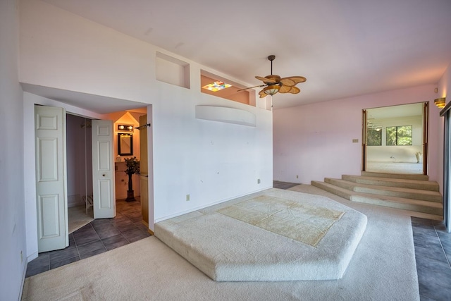 36-2335 Old Mamalahoa Hwy, Laupahoehoe, HI 96764 - tiled empty room featuring ceiling fan, carpet floors, and lofted ceiling