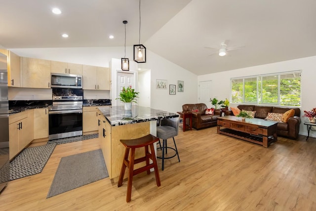 15-1798 20th Ave, Keaau, HI 96749 - kitchen with stainless steel appliances, light brown cabinets, open floor plan, lofted ceiling, and a kitchen island