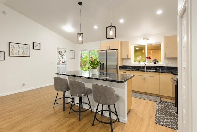 15-1798 20th Ave, Keaau, HI 96749 - kitchen featuring stainless steel appliances, light brown cabinets, vaulted ceiling, light wood-type flooring, and a kitchen island