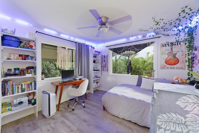 15-1565 Beach Rd, Keaau, HI 96749 - bedroom featuring wood finished floors, an office area, and a ceiling fan