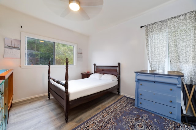 15-1565 Beach Rd, Keaau, HI 96749 - bedroom featuring wood finished floors, baseboards, and ceiling fan