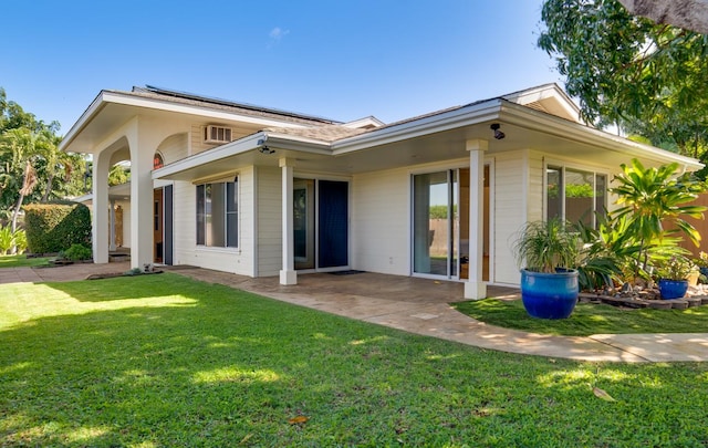 68-1842 Auhili Loop, Waikoloa, HI 96738 - back of house featuring a lawn, a patio, and solar panels