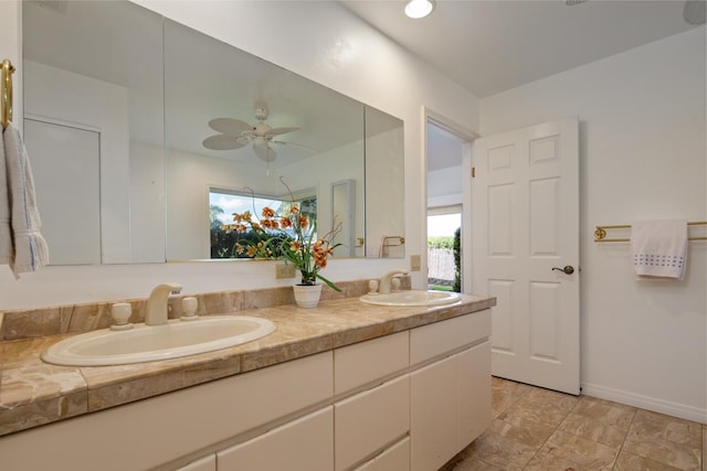 68-1842 Auhili Loop, Waikoloa, HI 96738 - bathroom featuring double vanity, baseboards, and a ceiling fan