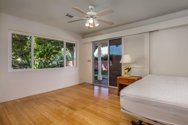 68-1842 Auhili Loop, Waikoloa, HI 96738 - bedroom featuring access to exterior, light wood finished floors, and ceiling fan