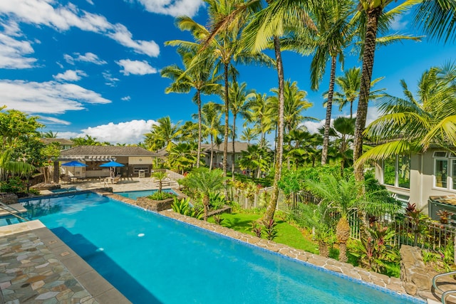 4100 Queen Emmas Dr Unit 64, Princeville, HI 96722 - outdoor pool with a patio area and a fenced backyard
