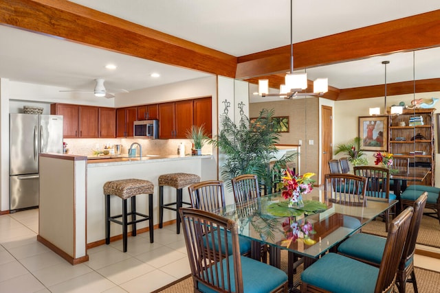 2221 Kapili Rd Unit 4, Koloa, HI 96756 - dining room with beamed ceiling, recessed lighting, light tile patterned flooring, and ceiling fan