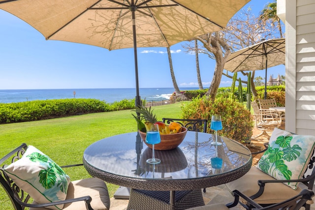 2221 Kapili Rd Unit 4, Koloa, HI 96756 - view of patio / terrace featuring outdoor dining area and a water view