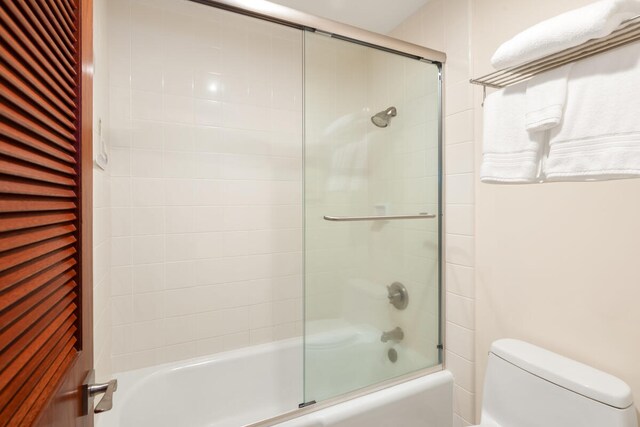 2221 Kapili Rd Unit 4, Koloa, HI 96756 - full bathroom with toilet and bath / shower combo with glass door