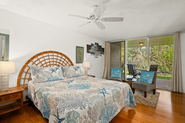 3811 Edward Rd Unit 1108, Princeville, HI 96722 - bedroom with access to outside, wood finished floors, floor to ceiling windows, a textured ceiling, and a ceiling fan