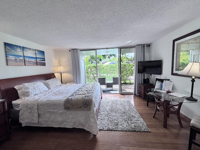 3811 Edward Rd Unit 1108, Princeville, HI 96722 - bedroom with access to outside, a textured ceiling, floor to ceiling windows, wood finished floors, and baseboards