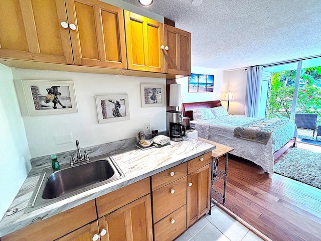 3811 Edward Rd Unit 1108, Princeville, HI 96722 - bedroom with a sink, a textured ceiling, and light tile patterned floors