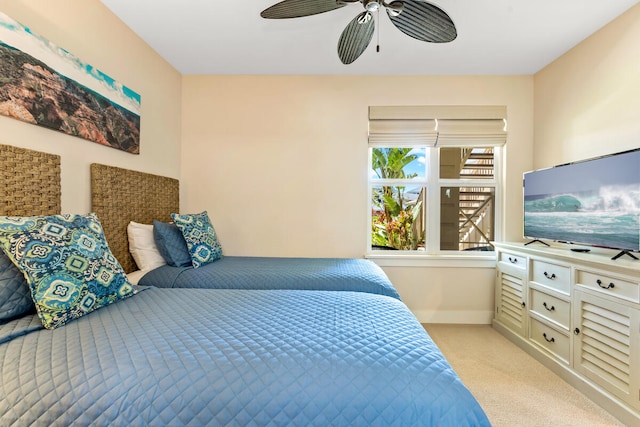 2611 Kiahuna Plantation Dr Unit 15F, Koloa, HI 96756 - bedroom with light carpet, baseboards, and a ceiling fan