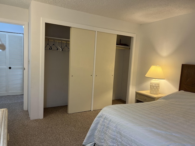 101 Hilo Lagoon Ctr Unit 403, Hilo, HI 96720 - carpeted bedroom with a textured ceiling