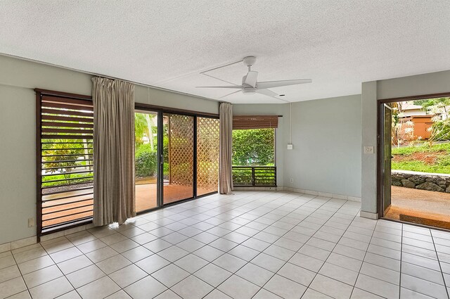 4701 Kawaihau Rd Unit A101, Kapaa, HI 96746 - spare room featuring a ceiling fan, a textured ceiling, and tile patterned floors