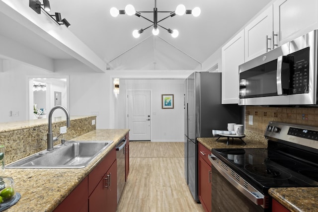 15-2774 Ahi St, Pahoa, HI 96778 - kitchen featuring stainless steel appliances, a chandelier, a sink, lofted ceiling, and light wood finished floors
