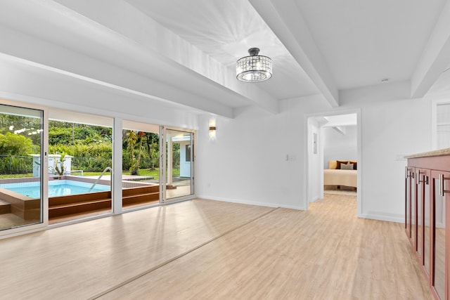 15-2774 Ahi St, Pahoa, HI 96778 - spare room with beamed ceiling, light wood finished floors, baseboards, and a chandelier