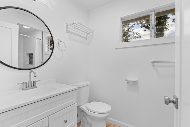 15-2774 Ahi St, Pahoa, HI 96778 - bathroom with toilet, vanity, wood finished floors, a shower with shower curtain, and baseboards