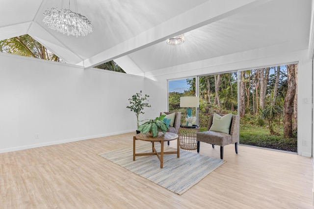 15-2774 Ahi St, Pahoa, HI 96778 - living area featuring a chandelier, lofted ceiling, wood finished floors, and baseboards