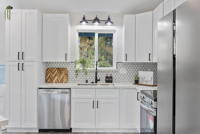 16-2050 Pikake Dr, Pahoa, HI 96778 - kitchen with stainless steel appliances, backsplash, and white cabinetry