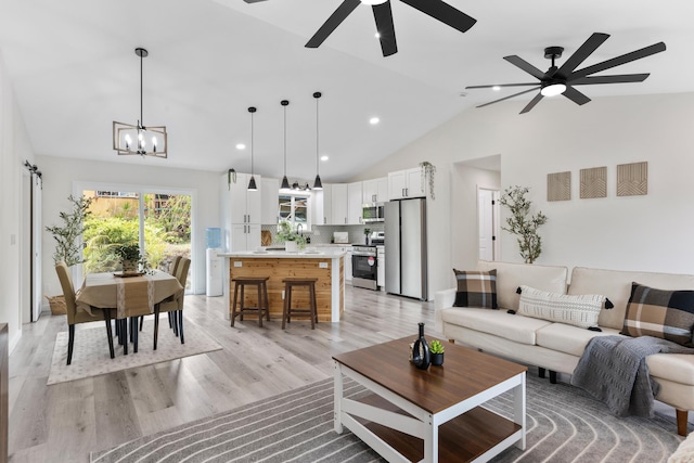 16-2050 Pikake Dr, Pahoa, HI 96778 - living room with ceiling fan, light wood-style floors, a chandelier, high vaulted ceiling, and recessed lighting
