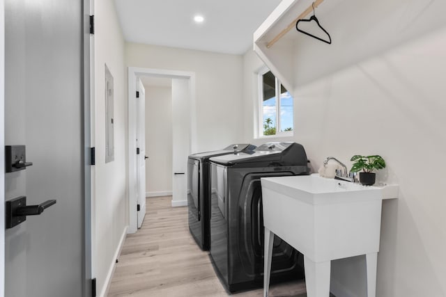 16-2050 Pikake Dr, Pahoa, HI 96778 - laundry room featuring separate washer and dryer, light wood-style flooring, and recessed lighting