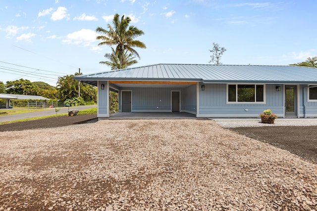 16-2050 Pikake Dr, Pahoa, HI 96778 - view of front of home featuring driveway, a metal roof, and an attached carport