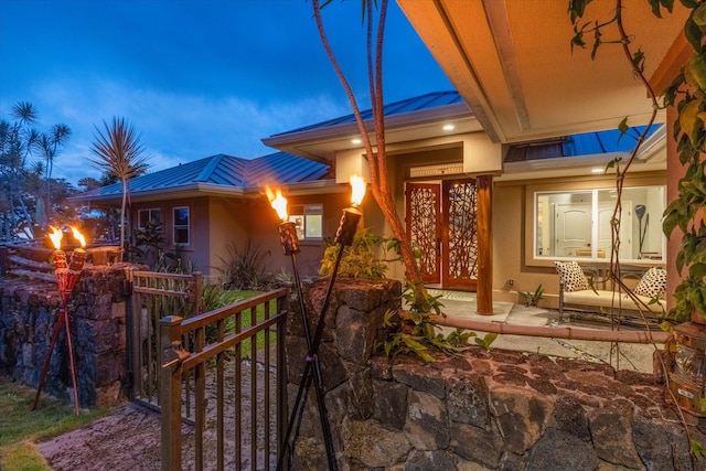 75-665 Kula Kai Pl, Kailua-Kona, HI 96740 - view of front of property with stucco siding, a metal roof, and a standing seam roof