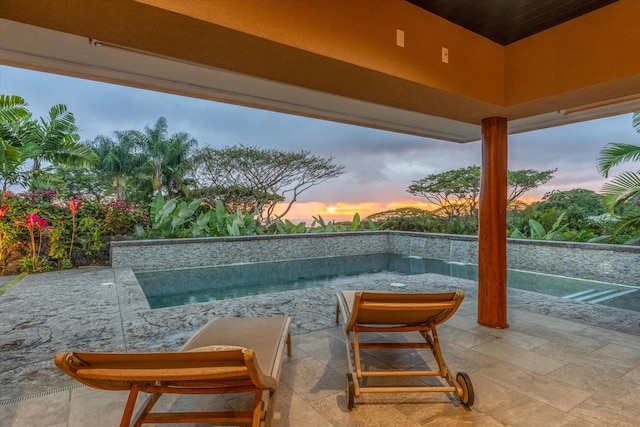 75-665 Kula Kai Pl, Kailua-Kona, HI 96740 - pool at dusk with a patio area