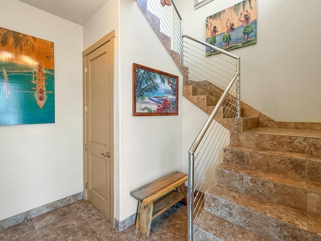 75-5952 Alii Dr, Kailua-Kona, HI 96740 - staircase featuring stone finish floors and baseboards
