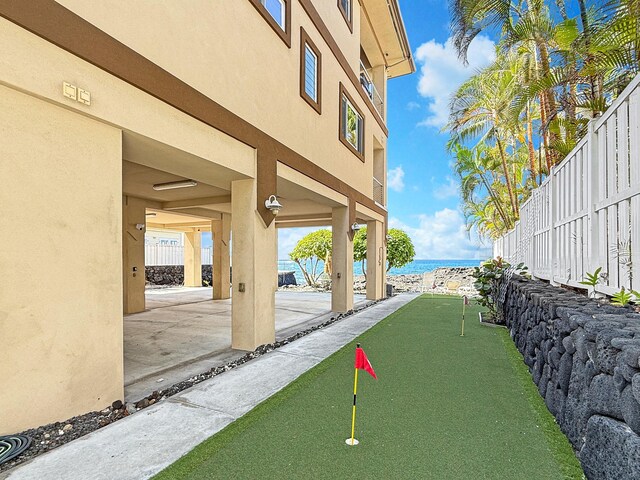 75-5952 Alii Dr, Kailua-Kona, HI 96740 - surrounding community featuring a putting area, view of water and beach, and a patio