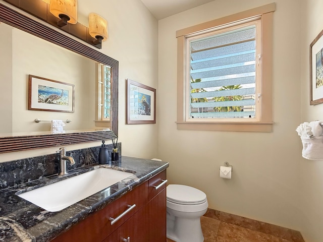 75-5952 Alii Dr, Kailua-Kona, HI 96740 - half bathroom with vanity, toilet, baseboards, and tile patterned flooring