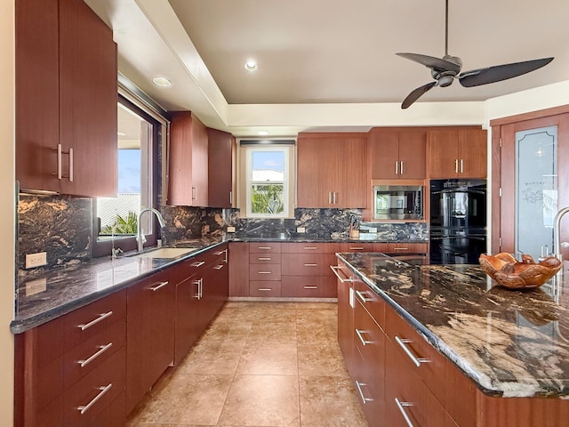 75-5952 Alii Dr, Kailua-Kona, HI 96740 - kitchen with stainless steel microwave, a sink, tasteful backsplash, dark stone counters, and a ceiling fan