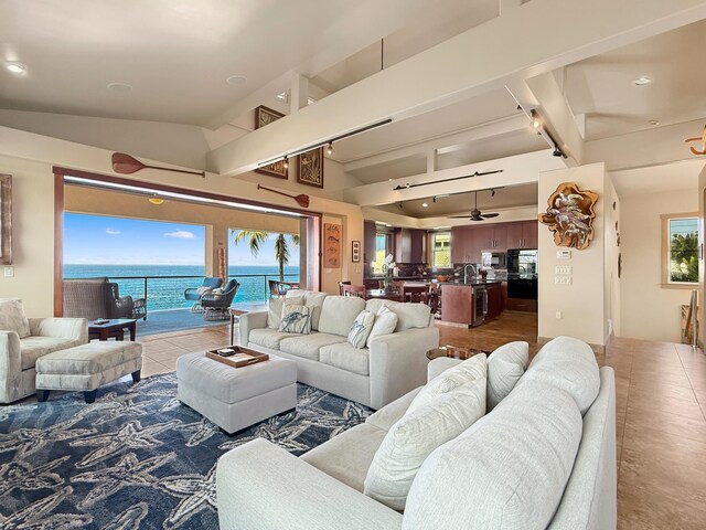 75-5952 Alii Dr, Kailua-Kona, HI 96740 - living area with vaulted ceiling, ceiling fan, tile patterned floors, recessed lighting, and a water view
