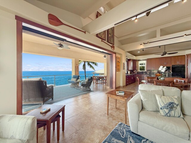 75-5952 Alii Dr, Kailua-Kona, HI 96740 - living area with ceiling fan, a water view, and light tile patterned floors