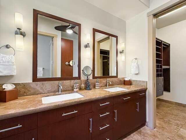 75-5952 Alii Dr, Kailua-Kona, HI 96740 - full bath with double vanity, a walk in closet, and baseboards