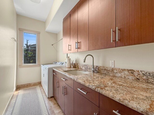 75-5952 Alii Dr, Kailua-Kona, HI 96740 - washroom with washing machine and dryer, cabinet space, and baseboards