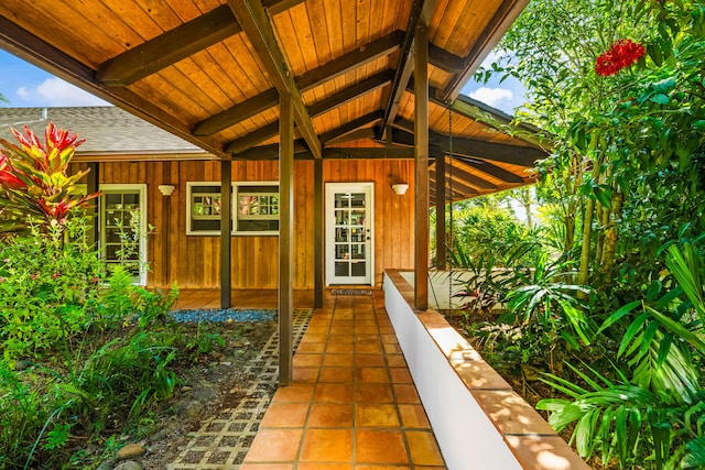 6161 Holio Rd, Kapaa, HI 96746 - property entrance featuring a shingled roof and covered porch