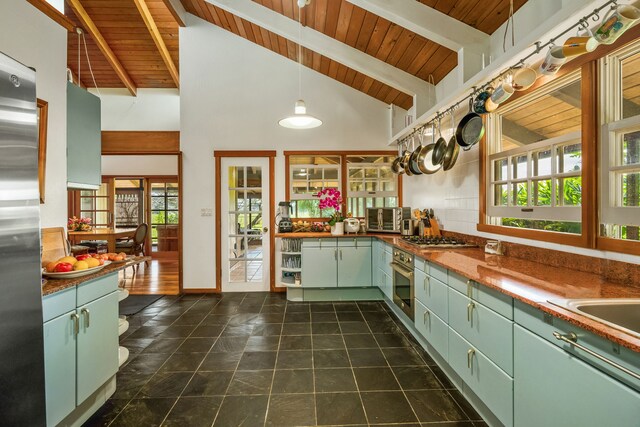 6161 Holio Rd, Kapaa, HI 96746 - kitchen featuring green cabinets, wood ceiling with exposed beams, stainless steel appliances, high vaulted ceiling, and dark countertops