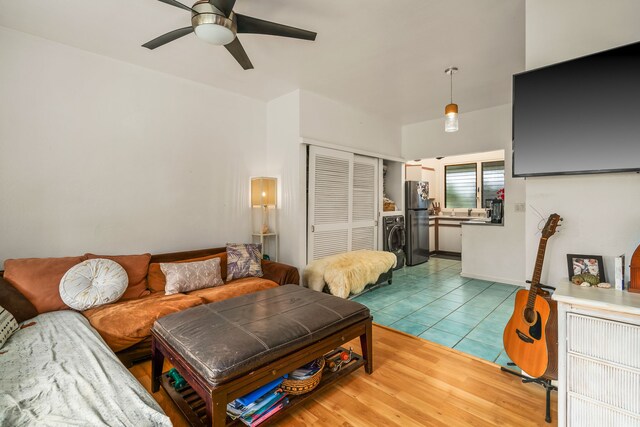 6161 Holio Rd, Kapaa, HI 96746 - living room featuring a ceiling fan, washer / clothes dryer, and light tile patterned floors