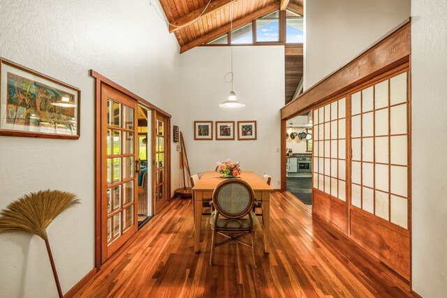 6161 Holio Rd, Kapaa, HI 96746 - dining space with high vaulted ceiling, french doors, wood-type flooring, wooden ceiling with exposed beams, and healthy amount of natural light