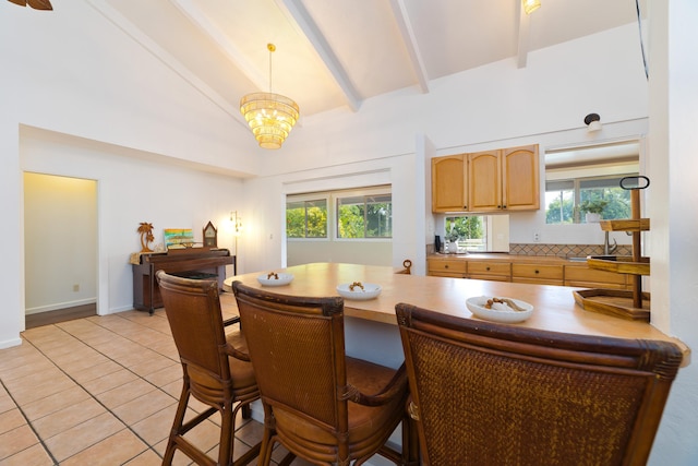 16-1381 Pohaku Cir, Keaau, HI 96749 - kitchen with light tile patterned floors, beam ceiling, light brown cabinets, a breakfast bar, and plenty of natural light